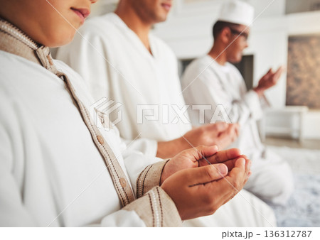 Prayer, muslim and dua with hands of family on living room floor for eid mubarak, God and worship. Quran, islamic and Ramadan with spiritual people praying at home for faith, religion and gratitude 136312787