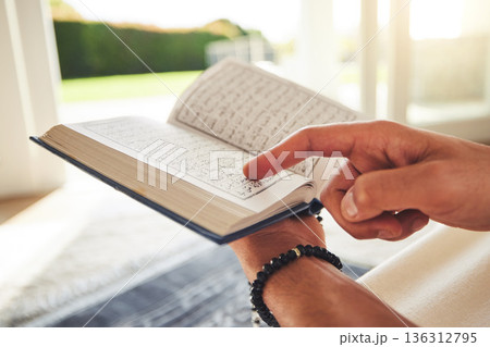 Reading book, muslim or hands of person with Quran on Eid Mubarak praying to God or worship at home. Allah, hope or Ramadan with spiritual man learning Islamic info for faith, religion and gratitude Reading book, muslim or hands of person with Quran on Eid Mubarak praying to God or worship at home. Allah, hope or Ramadan with spiritual man learning Islamic info for faith, religion and gratitude 136312795