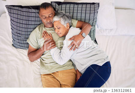 Top view, bed and senior couple hug, sleeping and marriage with peace, relationship and retirement. Romance, old man and elderly woman in a bedroom, asleep and embrace with happiness, home and care Top view, bed and senior couple hug, sleeping and marriage with peace, relationship and retirement. Romance, old man and elderly woman in a bedroom, asleep and embrace with happiness, home and care 136312861