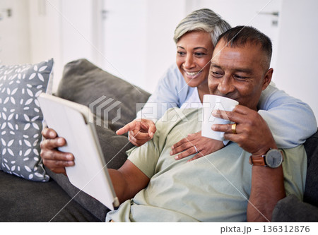 Home, tablet and happy senior couple on sofa, relax and check email, news article and point at online shopping choice. Website info, decision or elderly man, old woman or people smile in living room Home, tablet and happy senior couple on sofa, relax and check email, news article and point at online shopping choice. Website info, decision or elderly man, old woman or people smile in living room 136312876