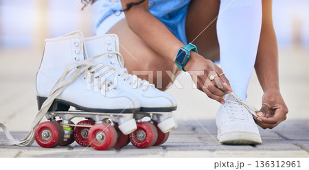 Hands, roller skates and tie shoes on street to start exercise, workout or training outdoor. Skating, person and tying sneakers to get ready for sports on road to travel, journey and fitness practice 136312961