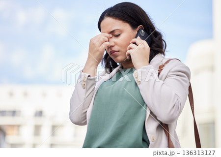 Headache, phone call and business woman stress in city with bad news and worry from work. Burnout, urban and female professional frustrated from job with anxiety and mobile networking in conversation 136313127