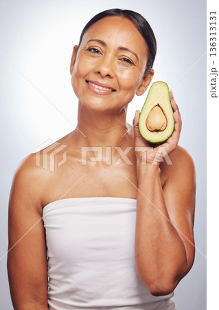 Skincare, portrait and senior woman with avocado in studio isolated on a white background. Face, natural fruit and happy model with food for organic nutrition, healthy diet and omega 3 for anti aging Skincare, portrait and senior woman with avocado in studio isolated on a white background. Face, natural fruit and happy model with food for organic nutrition, healthy diet and omega 3 for anti aging 136313131