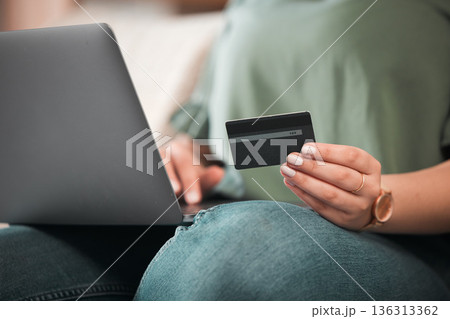 Hand, laptop and credit card for online shopping with a customer on the internet from home. Computer, ecommerce and payment with a person using a bank app for finance, accounting or budget planning Hand, laptop and credit card for online shopping with a customer on the internet from home. Computer, ecommerce and payment with a person using a bank app for finance, accounting or budget planning 136313362