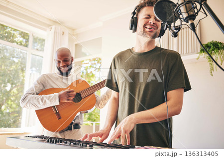 Piano, microphone and friends singing with guitar in home studio together. Electric keyboard, acoustic instrument or recording for collaboration, creative music production and headphones of happy men 136313405