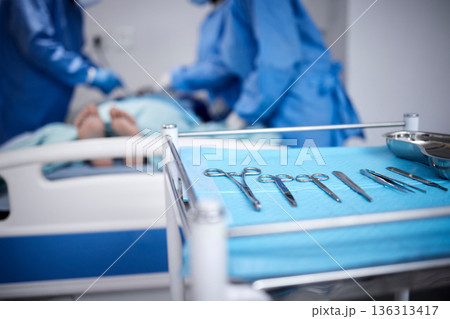 Surgery, equipment or doctors with scissors for emergency surgical procedure or healthcare in hospital. Blur, teamwork or surgeons helping in operating room in clinic with metal medical safety tools Surgery, equipment or doctors with scissors for emergency surgical procedure or healthcare in hospital. Blur, teamwork or surgeons helping in operating room in clinic with metal medical safety tools 136313417