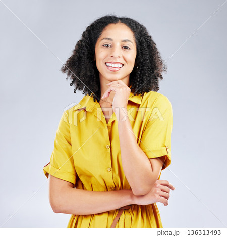 Portrait, fashion and smile with a model woman in studio on a gray background for trendy style. Yellow, beauty and a happy or confident young female person with an afro posing in a clothes outfit Portrait, fashion and smile with a model woman in studio on a gray background for trendy style. Yellow, beauty and a happy or confident young female person with an afro posing in a clothes outfit 136313493