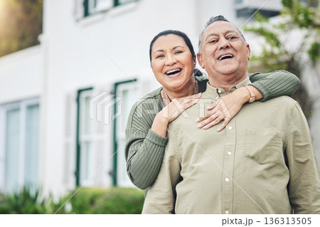 Love, portrait and senior couple embracing in the backyard garden of their family home. Happy, smile and elderly man and woman in retirement hugging and bonding together outdoor of their modern house Love, portrait and senior couple embracing in the backyard garden of their family home. Happy, smile and elderly man and woman in retirement hugging and bonding together outdoor of their modern house 136313505