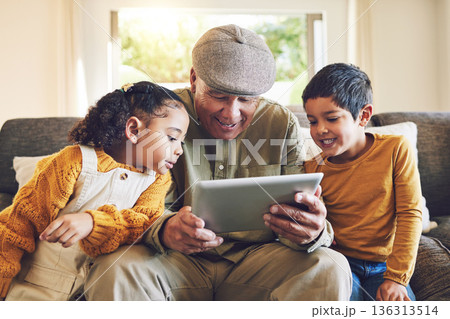 Young kids, grandfather and tablet, relax together and watch cartoon or e learning with games while at home. Bonding, love and spending quality time, old man and grandkids with gadget and internet Young kids, grandfather and tablet, relax together and watch cartoon or e learning with games while at home. Bonding, love and spending quality time, old man and grandkids with gadget and internet 136313514