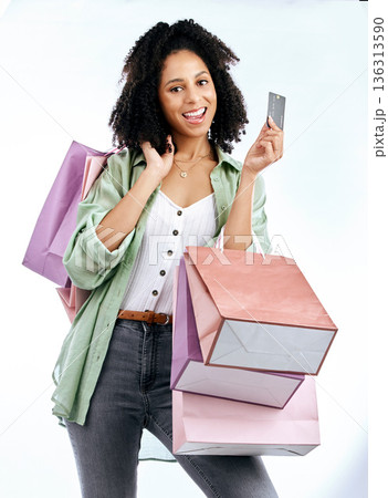 Portrait, shopping bags and happy woman with credit card in studio for sale, discount or promo on white background. Face, payment and lady customer excited by retail, mall or boutique store giveaway 136313590