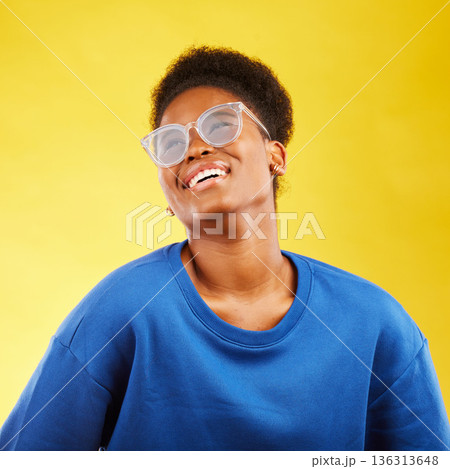 Happy, fashion and glasses with face of black woman in studio for vision, eye care and trendy style. Gen z, smile and happiness with female person on yellow background for expert, health and idea 136313648