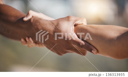 People, holding hands and pull arm for teamwork, solidarity and trust for safety, training or exercise in nature. Team, support and helping for kindness, strong and care with fitness, workout or goal 136313935