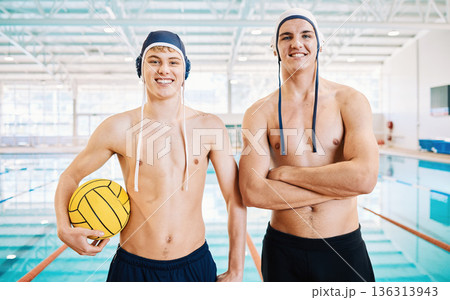 Sports, swimming and portrait of male athletes with crossed arms for confidence before a competition. Fitness, smile and body of men swimmers with a volleyball standing by pool for a water polo match 136313943