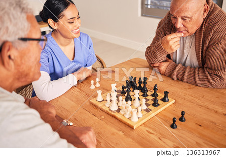 Retirement, playing and chess with senior men at nursing home for fun activity in home with nurse at table. Strategy, chessboard and challenge with elderly friends together on table for bonding. 136313967
