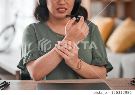 Woman, hands and wrist pain in remote work from injury, typing or overworked by desk at home office. Closeup of female person or call center consultant with sore ache, joint or carpal tunnel syndrome 136313980
