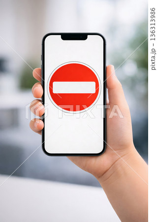 Child holding smartphone with digital access restriction symbol Child holding smartphone with digital access restriction symbol 136313986