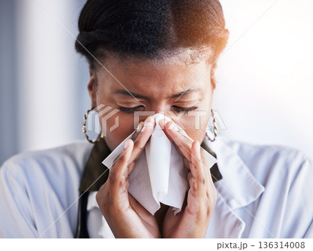 Sick, black woman or a doctor blowing nose for an allergy, virus or flu at work. Covid, healthcare and an African nurse or surgeon with a tissue for sneezing, health and a cold while at a clinic Sick, black woman or a doctor blowing nose for an allergy, virus or flu at work. Covid, healthcare and an African nurse or surgeon with a tissue for sneezing, health and a cold while at a clinic 136314008