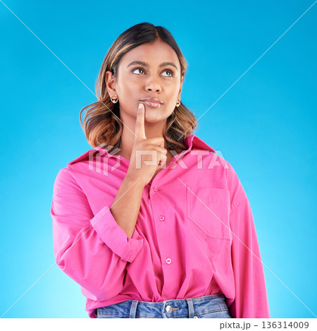Thinking, planning and a woman on a blue background with knowledge, idea and inspiration. Dream, young and an Indian girl with a vision of an opportunity, decision or a choice isolated on a backdrop Thinking, planning and a woman on a blue background with knowledge, idea and inspiration. Dream, young and an Indian girl with a vision of an opportunity, decision or a choice isolated on a backdrop 136314009