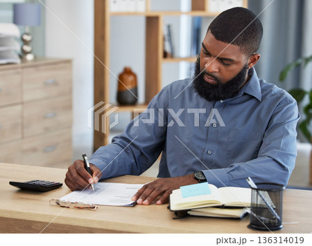 Black man, planning finance or working on budget in home or remote work, accounting or writing on documents or paper. Tax, audit or businessman in office with financial strategy or accountant Black man, planning finance or working on budget in home or remote work, accounting or writing on documents or paper. Tax, audit or businessman in office with financial strategy or accountant 136314019