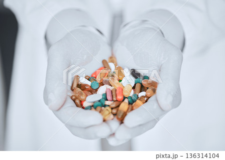 Pharmacy, medicine and pills with hands of doctor for offer, wellness and supplements. Pharmacist, medical and healthcare with closeup of person and capsules for vitamins, product and prescription 136314104