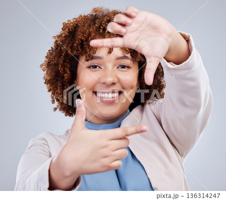 Hand, frame and happy woman portrait in studio with sign for photo, photography or fun picture on grey background. Face, lady and beauty influencer with emoji finger for social media or selfie smile 136314247