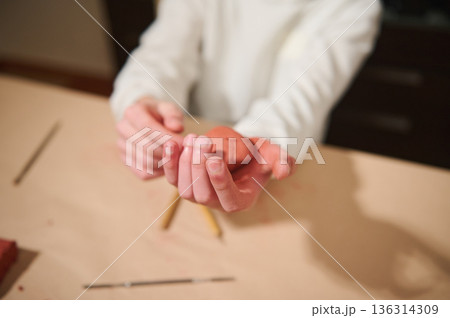 Multicultural Boy Molding Clay At Home: Focused On Creative Hobby And Hands-On Art 136314309