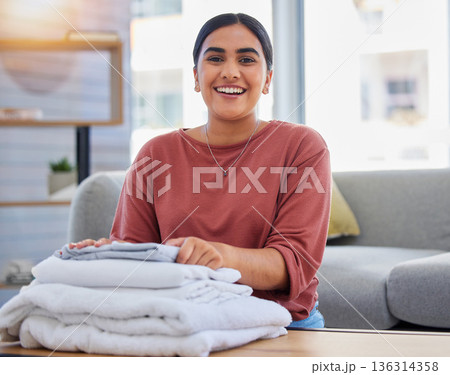 Cleaning, smile and laundry with portrait of woman in living room for housekeeping service, clothes and fabric. Hospitality, happy and cleaner with person at home for maintenance and washing Cleaning, smile and laundry with portrait of woman in living room for housekeeping service, clothes and fabric. Hospitality, happy and cleaner with person at home for maintenance and washing 136314358