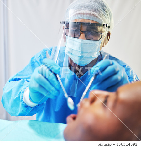 Dentist, consultation and man check patient mouth, dental healthcare and medical procedure at clinic. PPE, dentistry and orthodontics treatment, male person with oral care tools and teeth whitening Dentist, consultation and man check patient mouth, dental healthcare and medical procedure at clinic. PPE, dentistry and orthodontics treatment, male person with oral care tools and teeth whitening 136314392