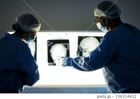 Dentist team, teeth x ray and together for analysis, study and learning in clinic for healthcare. Surgeon group, monitor skull and tooth growth for wellness, care or point with discussion in hospital Dentist team, teeth x ray and together for analysis, study and learning in clinic for healthcare. Surgeon group, monitor skull and tooth growth for wellness, care or point with discussion in hospital 136314412