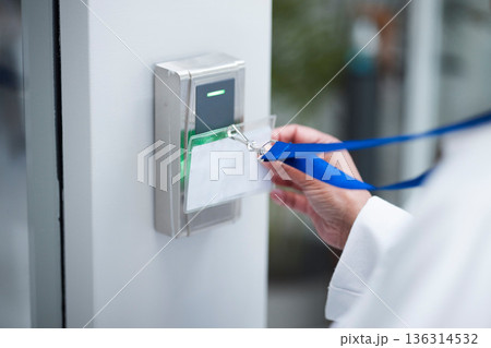 Hand, key card and scan for security door, entrance or access control for safety in business, facility and property. Hands, electronic keys and laser reader or technology to lock or secure laboratory 136314532
