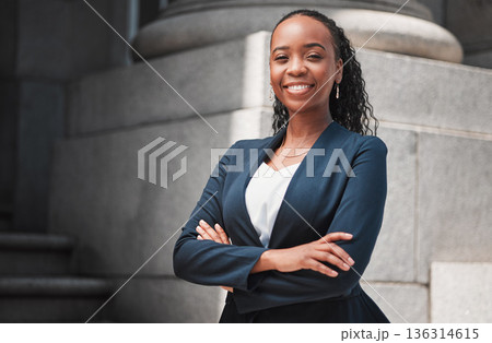 Arms crossed, lawyer or portrait of happy black woman with smile or confidence working in a law firm. Confidence, empowerment or proud African attorney with leadership or vision for legal agency 136314615