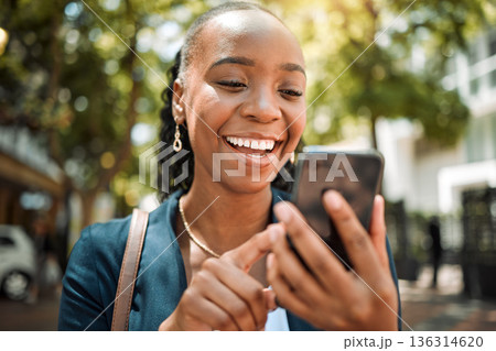 Outdoor, black woman and smartphone with a mobile app typing and happiness with social media, contact and email. Thinking, female person or girl with a cellphone, connection or website info in a city 136314620