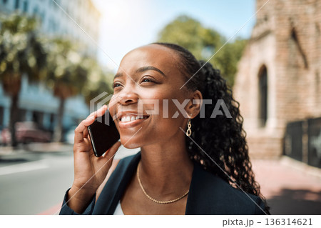 Happy black woman, phone call and city in travel, conversation or communication outdoors. African female person smile for business discussion, networking or work trip on smartphone in an urban street 136314621