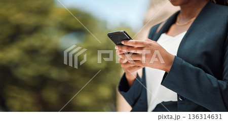 Woman, hands and phone in city for communication, social media or networking outdoors. Closeup of female person chatting, texting or typing on mobile smartphone app for online browsing in urban town 136314631