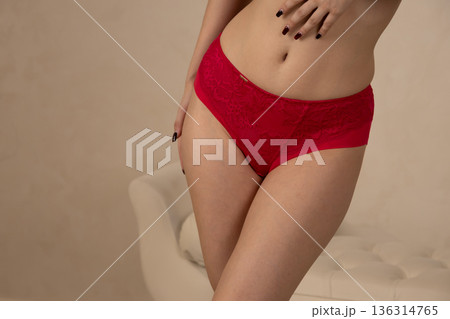 Close up of woman wearing red underwear Close up of woman wearing red underwear 136314765