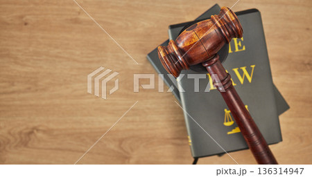 Background, law books and gavel on table at mockup space of judge, justice or lawyer in courtroom. Overhead, hammer and research knowledge of legal system, constitution and truth, litigation or trial Background, law books and gavel on table at mockup space of judge, justice or lawyer in courtroom. Overhead, hammer and research knowledge of legal system, constitution and truth, litigation or trial 136314947