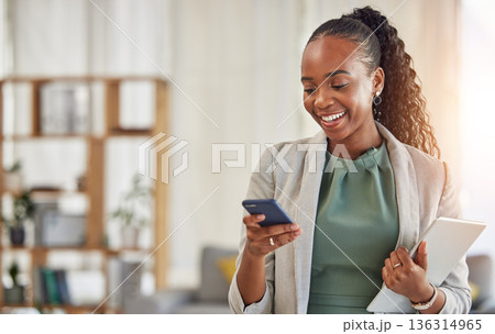 Happy black woman, phone and communication at office with smile in networking or social media. African female person or employee enjoying online browsing or chat on mobile smartphone app at workplace Happy black woman, phone and communication at office with smile in networking or social media. African female person or employee enjoying online browsing or chat on mobile smartphone app at workplace 136314965