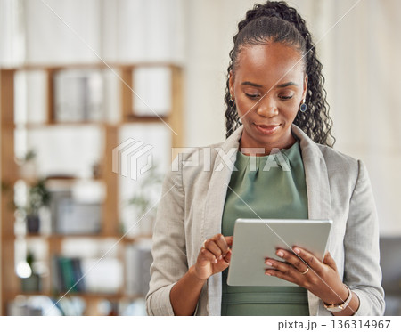 Black woman, tablet and planning in office for business information, data analysis or internet research. Female employee working on digital technology for online connection, website and scroll on app 136314967