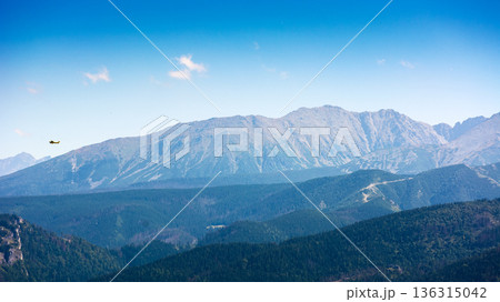 beautiful landscape of mountain range in poland, europe. panoramic travel background of high tatra in summer. scenic view of alpine region for picturesque journey in the afternoon beautiful landscape of mountain range in poland, europe. panoramic travel background of high tatra in summer. scenic view of alpine region for picturesque journey in the afternoon 136315042