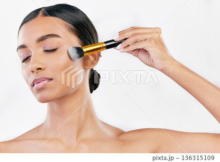 Facial, skincare and woman with makeup, brush and dermatology against a white studio background. Beauty, female person and model with cosmetics tool, self care and luxury with wellness and grooming Facial, skincare and woman with makeup, brush and dermatology against a white studio background. Beauty, female person and model with cosmetics tool, self care and luxury with wellness and grooming 136315109
