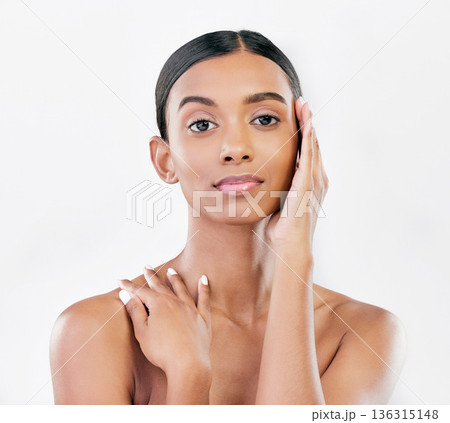 Beauty, natural and face portrait of a woman with a skincare glow isolated on a white background. Dermatology, makeup and cosmetics of Indian person for facial shine, touch or self care in studio 136315148