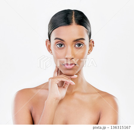 Beauty, face and portrait of serious woman with natural skincare isolated on a white background. Dermatology, makeup glow or cosmetics with Indian female model for facial shine or self love in studio Beauty, face and portrait of serious woman with natural skincare isolated on a white background. Dermatology, makeup glow or cosmetics with Indian female model for facial shine or self love in studio 136315167