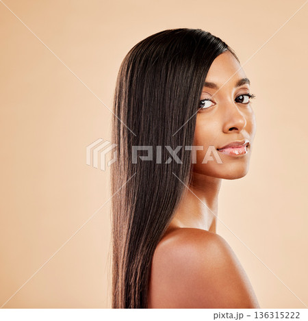 Woman, portrait and haircare in beauty salon, cosmetics or skincare against a studio background. Female person with long hair posing in relax or satisfaction for keratin spa treatment on mockup space Woman, portrait and haircare in beauty salon, cosmetics or skincare against a studio background. Female person with long hair posing in relax or satisfaction for keratin spa treatment on mockup space 136315222