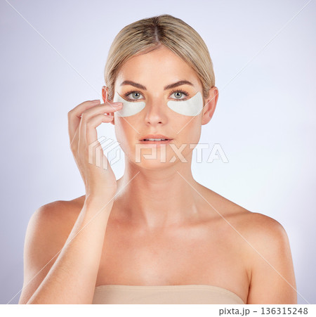Skincare, portrait and woman with eye patch for facial hydration, beauty care or collagenwhite. glow. Anti aging product, cosmetic repair benefits or person with studio face mask on white background Skincare, portrait and woman with eye patch for facial hydration, beauty care or collagenwhite. glow. Anti aging product, cosmetic repair benefits or person with studio face mask on white background 136315248