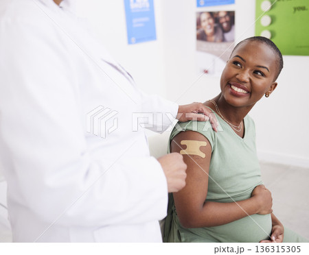Healthcare, vaccine and pregnant woman with doctor and support, covid safety and consulting. Happy, hospital and an African patient with nurse after vaccination during pregnancy for virus security 136315305