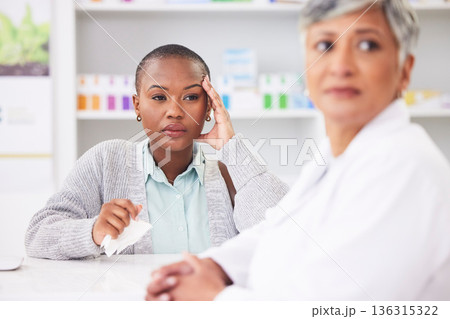 Consultation, pharmacy and a black woman with a headache and a doctor for healthcare advice. Support, pharmacist and an African patient at a clinic with a migraine and medical worker for help Consultation, pharmacy and a black woman with a headache and a doctor for healthcare advice. Support, pharmacist and an African patient at a clinic with a migraine and medical worker for help 136315322
