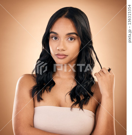 Portrait, serious woman and hair care, beauty and curly isolated in studio on a brown background. Face, natural cosmetics and female model with salon treatment for aesthetic, wellness and hairstyle. Portrait, serious woman and hair care, beauty and curly isolated in studio on a brown background. Face, natural cosmetics and female model with salon treatment for aesthetic, wellness and hairstyle. 136315354