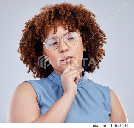 Woman with ideas, thinking and isolated in studio, creative mindset for young model with afro and glasses. Problem solving, brainstorming and focus, African girl with hand on face on white background 136315403