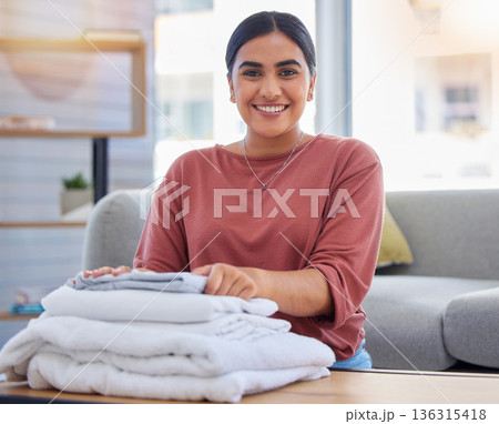 Cleaning, happy and laundry with portrait of woman in living room for housekeeping service, clothes and fabric. Hospitality, smile and cleaner with person at home for maintenance and washing Cleaning, happy and laundry with portrait of woman in living room for housekeeping service, clothes and fabric. Hospitality, smile and cleaner with person at home for maintenance and washing 136315418