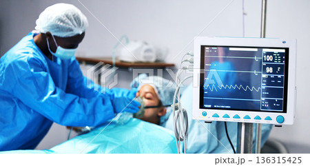 Healthcare, doctor and patient in oxygen mask with monitor for surgery, emergency care and hospital. Breathing, screen and surgeon helping person in operation, digital graphs to check medical results Healthcare, doctor and patient in oxygen mask with monitor for surgery, emergency care and hospital. Breathing, screen and surgeon helping person in operation, digital graphs to check medical results 136315425